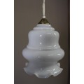 A beautiful white glass single pendant ceiling light, perfect in formal rooms.