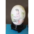 Three stunning hand painted Oriental themed egg ornaments on wooden stands, stunning in a collection