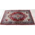 A stunning 95cm x 153cm hand knotted thick pile Persian carpet in dark reds. Gorgeous in all rooms!