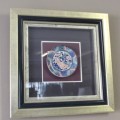 A gorgeous hand painted oriental "Imari" decorative porcelain plate in a box frame behind glass.