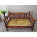 A wonderful well-made, sturdy vintage 2 seater Teak wood bench on castors, perfect  in a lapa/ patio