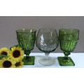 A fabulous set of 3 coloured glasses in different shapes and sizes!! Lovely on a summer table.
