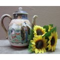 A gorgeous little oriental porcelain tea pot, with gold gilt. Stunning in a kitchen cabinet!