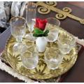 An eye-catching, round gold-coloured glass tray, with a beautiful pattern. Perfect on display!