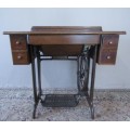 A remarkable vintage (1956-1961) Singer oak & cast iron stand with a 319K model sewing machine in