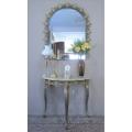 An exquisite moulded solid brass mirror & marble half moon table with ornate detailing. Wow!!!