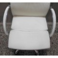 A lovely modern styled white faux leather office chair with height adjuster.