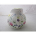 A gorgeous made in England "Nina Campbell" fine bone china milk jug/ creamer Meadow Flower pattern.