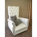 An exceptional oversized Queen wing back chair in durable white faux leather. Great "Feature" chair