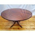 An exquisite claw footed Regency style round dining table (134cm x 75cm). Xmas sale