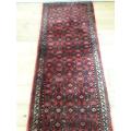A stylish Hossenabad Persian runner carpet (80cm x 397cm).