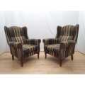 A pair of vintage Queen Anne footed Wingback upholstered arm chairs