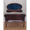 A stunning antique solid oak wash stand with cobalt-blue tiles, grey granite top and bobbin legs