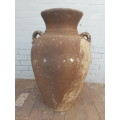 A large concrete free standing outdoor vase. Stunning in a garden!