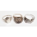 Three pretty stamped silver ladies rings