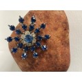 Silver Tone Snowflake Brooch With Royal Blue Stones & Flower In The Middle