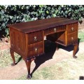 Very pretty, Stinkwood, Ball and Claw desk with five drawers and lovely linnenfold fronts.