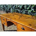 Lovely 1800`s, rustic Oregon desk / table with four drawers, cup handles and thick tapered legs.