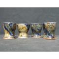Set of Four Glazed Pottery Egg Cups