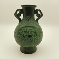 SOLID BRONZE ANTIQUE CHINESE VASE WITH RAISED RELIEF DECORATION.