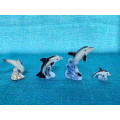 Porcelain dolphins (4) vintage, approx.from the  80s, collection item,