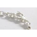 AN ELEGANT SOLID STERLING SILVER BRACELET WITH OVAL LINKS AND SIGNORETTI CLASP
