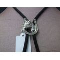 A LUCKY VINTAGE BOLO TIE WITH HORSE AND HORSESHOE MOTIF....COWBOY ACCESSORY !!