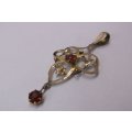 A BEAUTIFUL OLD ART NOUVEAU STYLE 9 CT GOLD PENDANT SET WITH TWO FACETED RED STONES ...WOW !!!