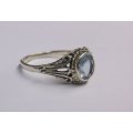 A FANTASTIC SOLID STERLING SILVER RING SET WITH A BEAUTIFULLY FACETED LIGHT BLUE STONE ...NICE !!