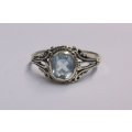 A FANTASTIC SOLID STERLING SILVER RING SET WITH A BEAUTIFULLY FACETED LIGHT BLUE STONE ...NICE !!