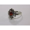 AN AWESOME SOLID STERLING SILVER RING WITH A STRIKING FACETED RED STONE ...MUST HAVE !!!