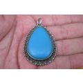 A GORGEOUS VINTAGE SOLID SILVER PENDANT WITH A TURQUOISE COLORED INSET ...BIG & EYE CATCHING !!