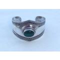 A vintage style solid sterling silver cuff bangle with cabochon green stone feature