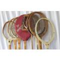 A collection of Vintage tennis racquets and a squash racquet
