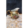 Unity teapot, sugar bowl, milk jug. Gilt with Victorian couple picture