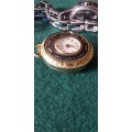 A Ladies Silver Tone Wrist Watch And A Gold Tone Pendant Watch - (Not Working)