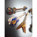 Hard Rock Cafe Guitar pins x 6 plus one other rock guitar