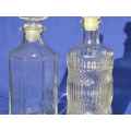 TWO GLASS DECANTERS