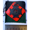 HS095 - Rhodesia Regiment badge on cloth Corps colours backing