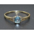 Attractive Blue Topaz & Diamond Ring in 9ct yellow gold
