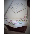 Stunning heirloom tablecloth, extensively hand embroidered flowers shades of lilacs, purples, greens