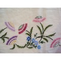 Stunning heirloom tablecloth, extensively hand embroidered flowers shades of lilacs, purples, greens