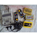 Vintage TV games console with 3 game cartridges - working