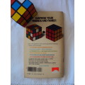 A Rubik's Cube plus a vintage book THE SIMPLE SOLUTION TO RUBIK'S CUBE