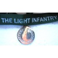 THE LIGHT INFANTRY MEDALLION ON A RIBBON IN VERY GOOD CONDITION