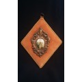 Silk printed picture in ornate gilt frame on velvet backing (numbered)