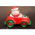 Cute little windup father christmas in his car - working