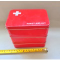 Three small empty first aid tins