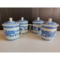 SET OF FOUR DRAGON MOTIF ORIENTAL LIDDED MUGS WITH THE MAKERS MARK AT THE BASE