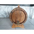 VINTAGE SOLID AND HEAVY OAK WINE BARREL WITH BRASS HOOPS ON A CUSTOM MADE STAND